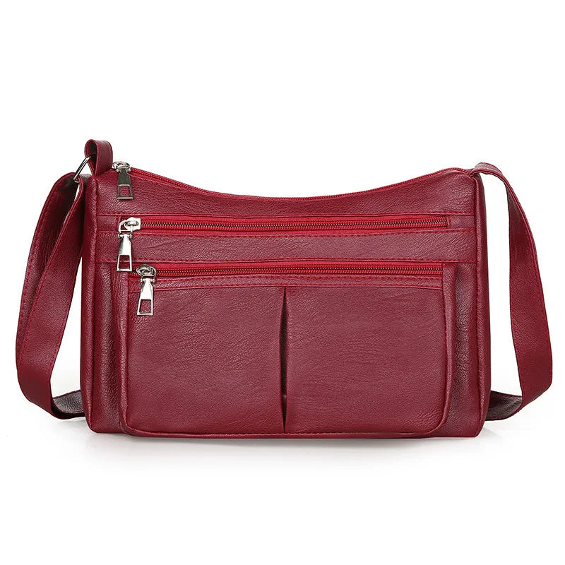 Hladká crossbody kabelka s viacerými vreckami