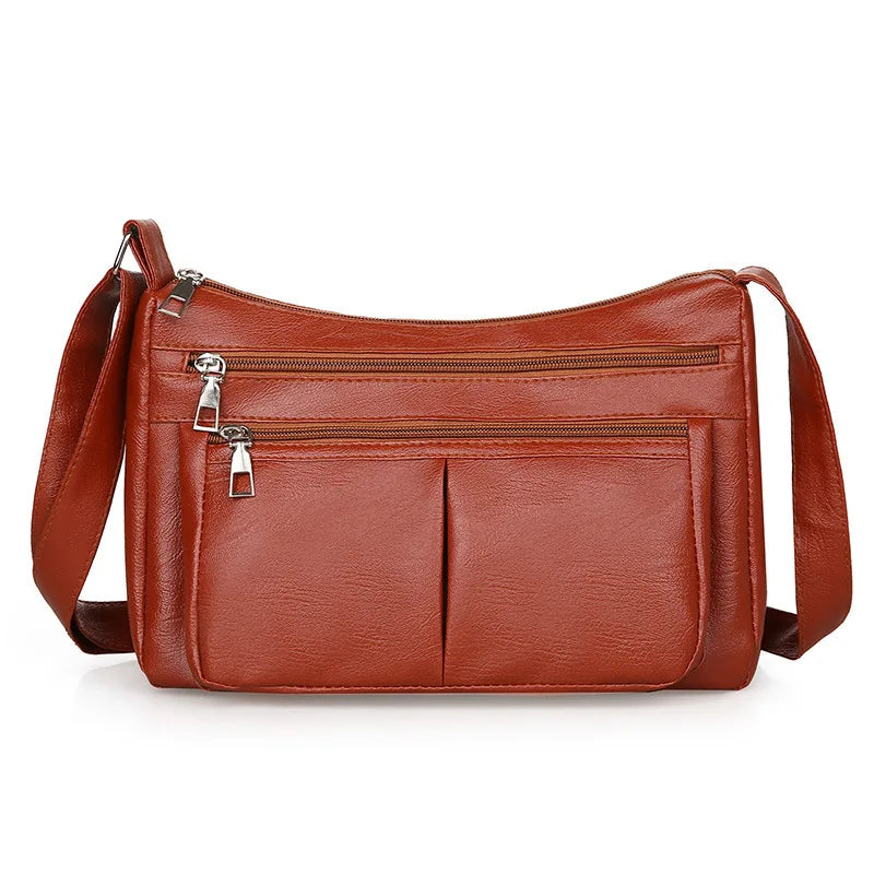 Hladká crossbody kabelka s viacerými vreckami