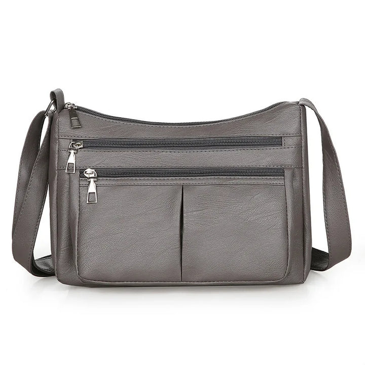 Hladká crossbody kabelka s viacerými vreckami
